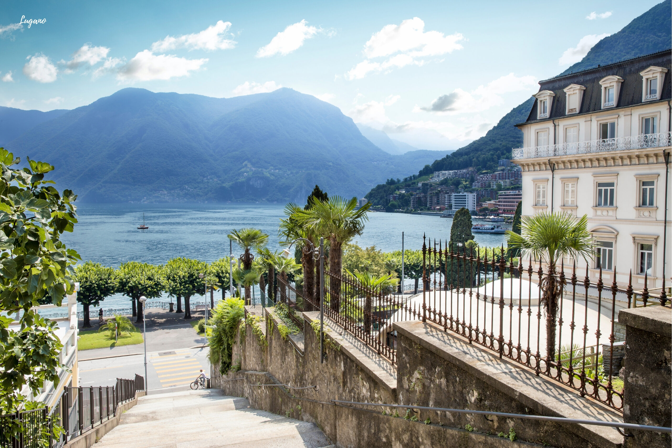 Wealth building strategies blog photo showing a view of the lake in Lugano, Switzerland